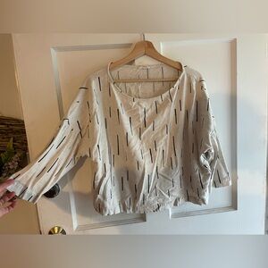 Stylish Cream Women's Top with Black Stripes